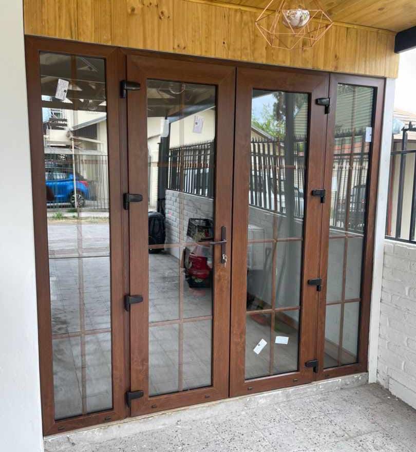 Puerta doble de PVC nogal con paños laterales